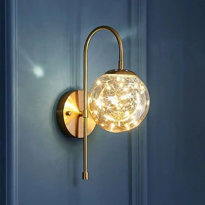Postmodern gold glass globe wall light fixture with warm fairy lights as a decorative bedroom wall light fixture