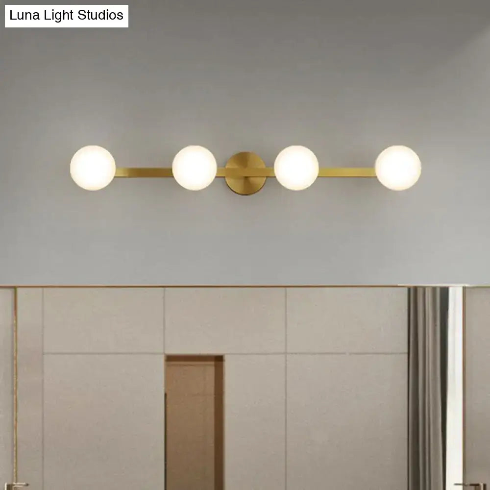 Postmodern gold glass globe wall sconce bathroom fixture with four frosted bulbs and 11in fixture height