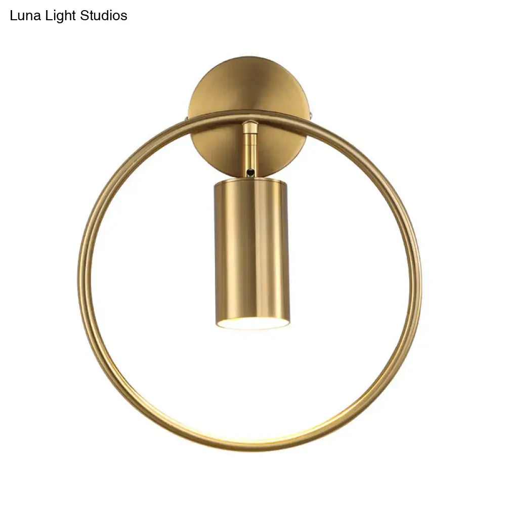 Postmodern gold-toned wall sconce with circular ring and cylindrical light fixture height 16 inches fixture for bedroom