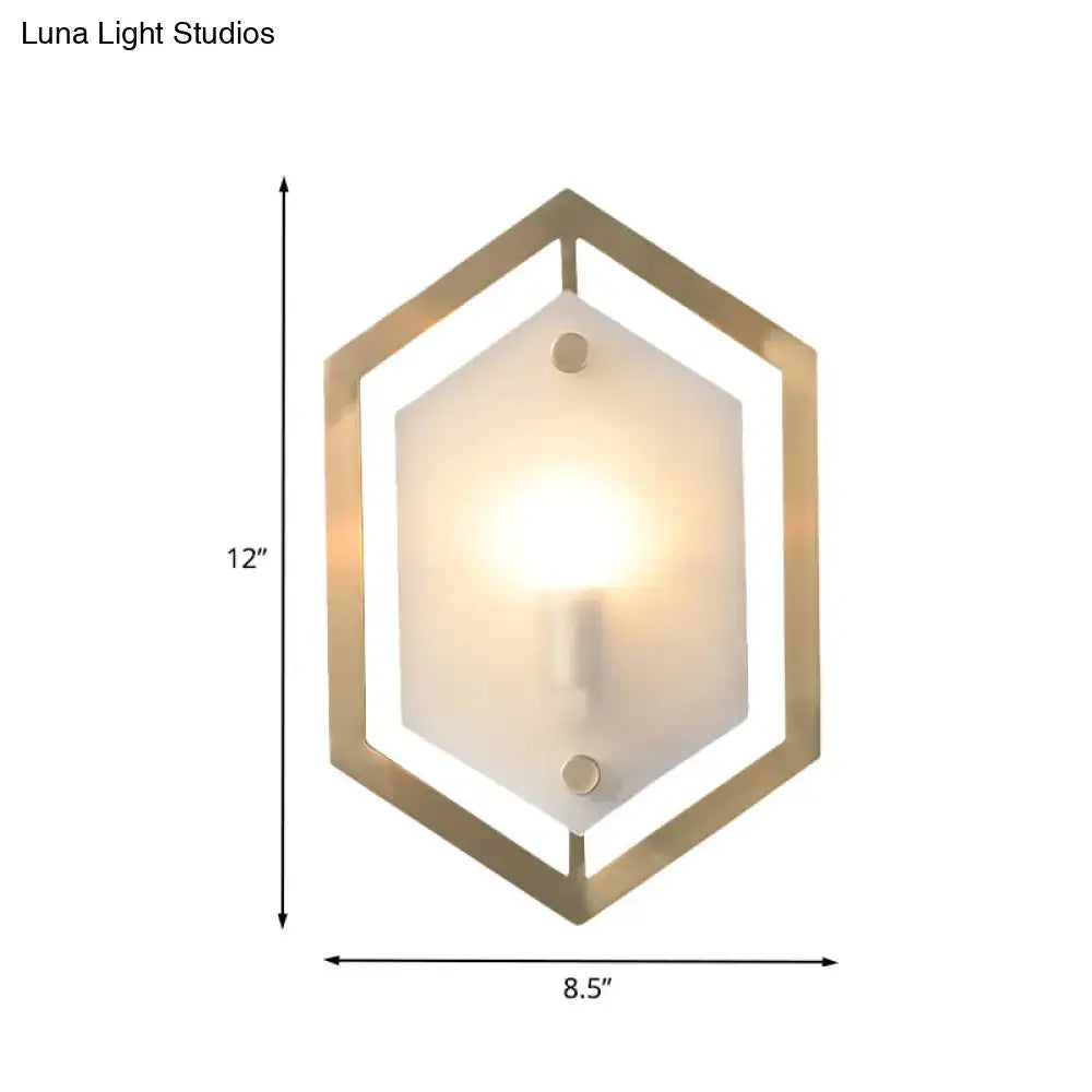 Postmodern gold hexagon wall lamp with frosted glass shade and illuminated bulb for stylish sconce lighting