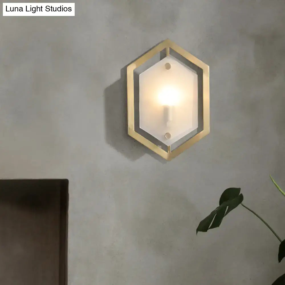 Postmodern gold hexagon wall lamp with frosted glass shade for elegant sconce lighting in bedroom settings