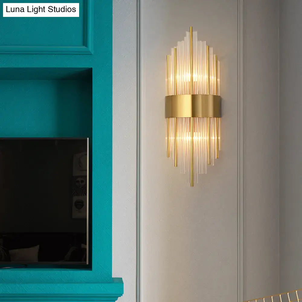Gold-toned postmodern wall sconce with k9 crystal glass rods and central metallic band for living room lighting