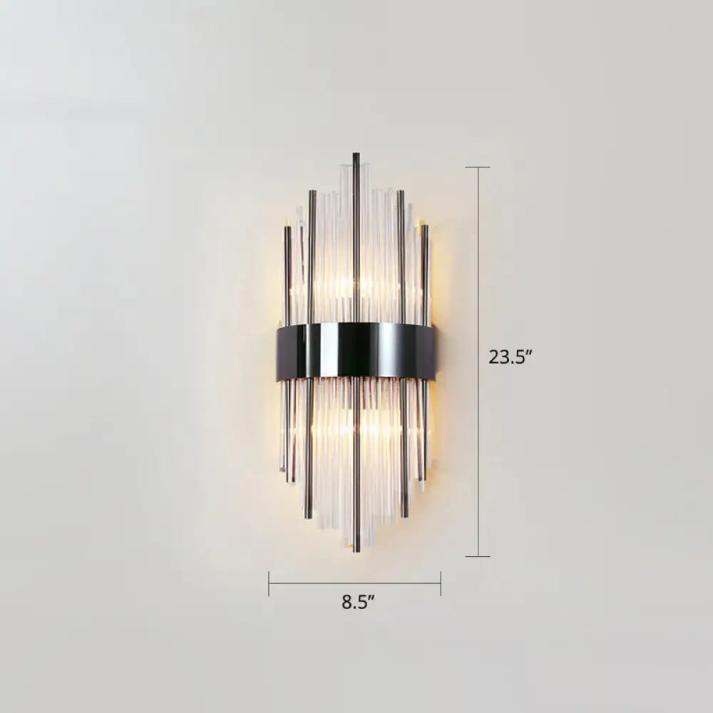 Postmodern gold k9 crystal wall sconce with black metal frame and glass rods emitting warm light for living room