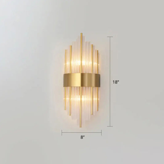Gold-toned postmodern wall sconce with vertical k9 crystal glass rods and metallic band for living room lighting