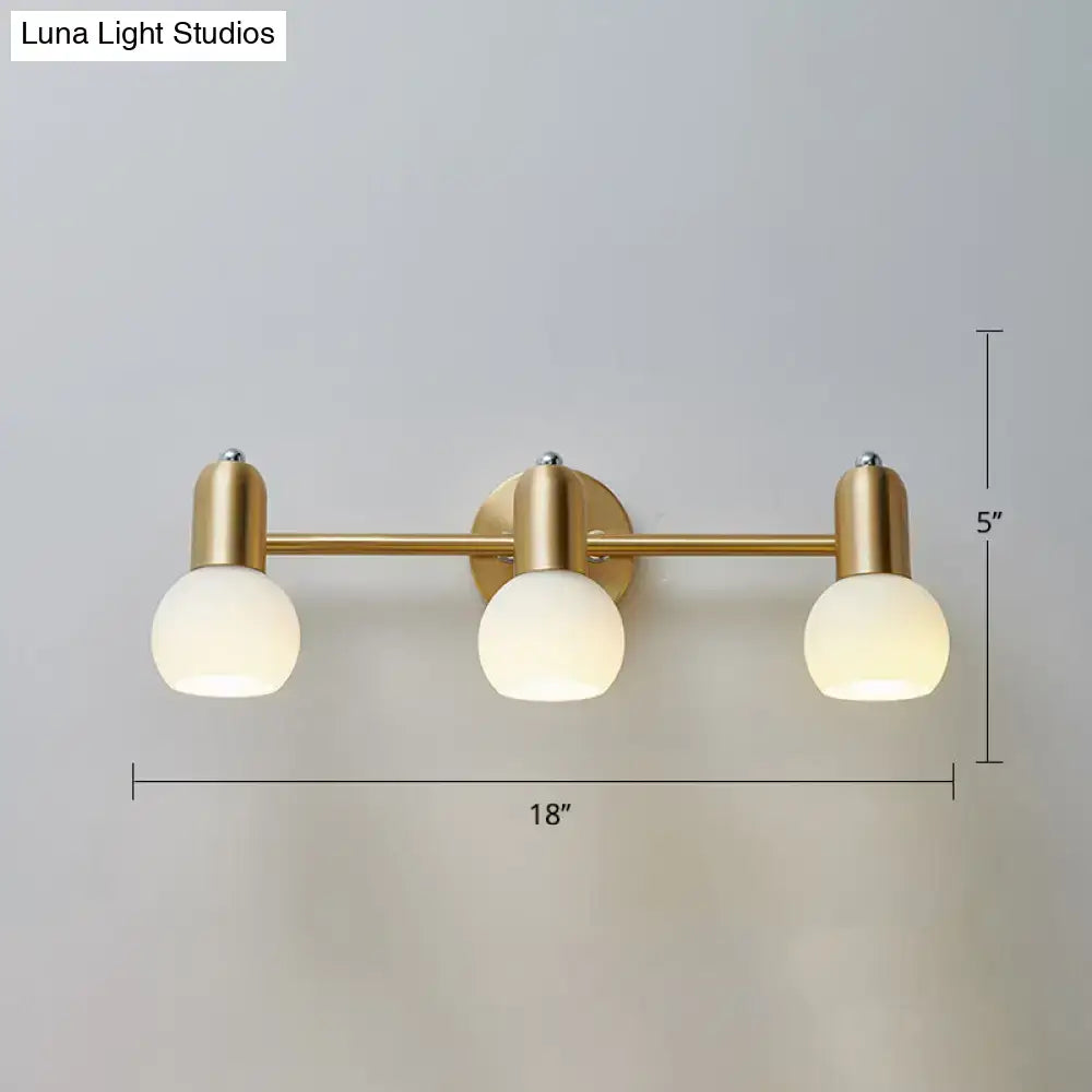 Postmodern gold swivel dome milk glass vanity light with three frosted globe bulbs for bathroom use