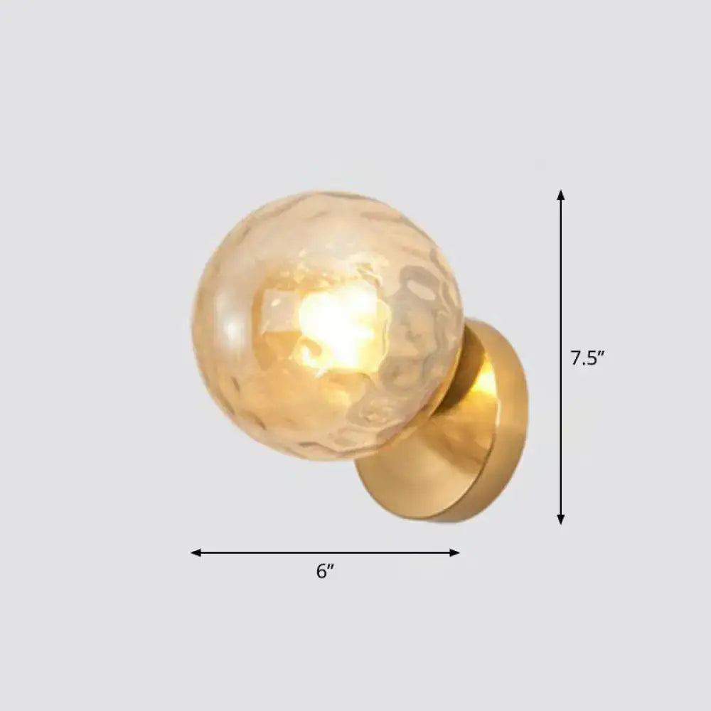Postmodern gold ball wall sconce with textured amber glass globe ideal for stairway wall lighting and lamp use