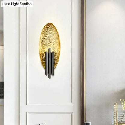 Gold-toned textured oval postmodern led oblong wall lamp feature with black accents for bedroom 110v-120v use