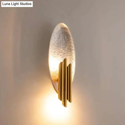 Gold-toned postmodern led oblong wall lamp feature with textured oval glass panel and vertical brass rods for 110v-120v use