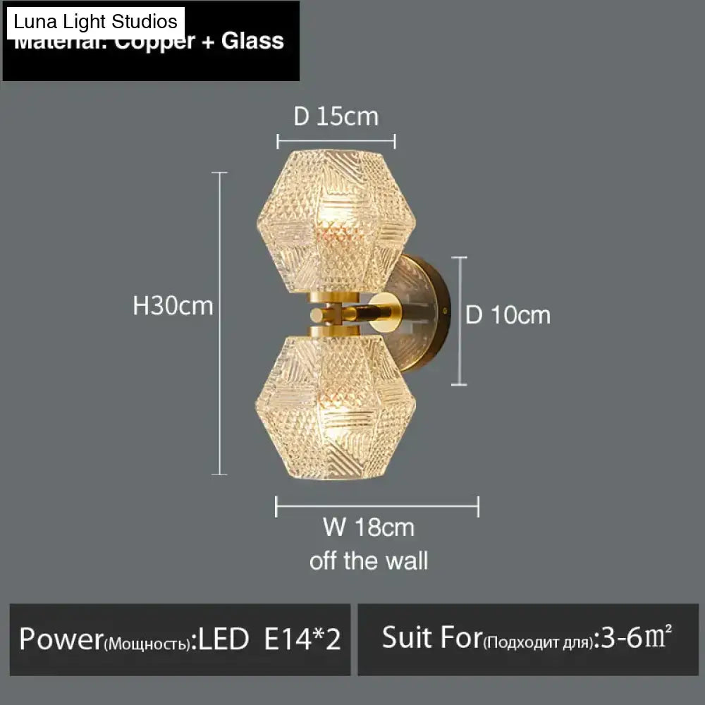 Gold-toned copper nordic postmodern luxury led wall sconce with two hexagonal faceted glass shades for bedroom light