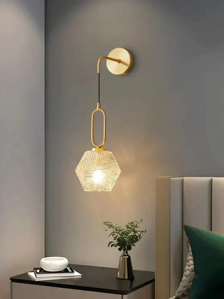 Gold-toned postmodern luxury led wall sconce with geometric woven glass shade for bedroom lighting