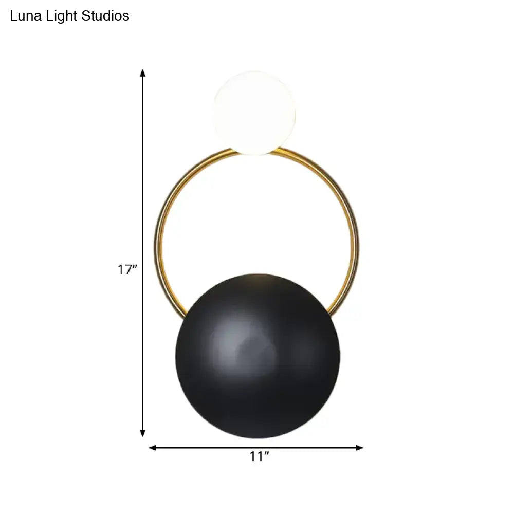 Postmodern orbital flush mount wall sconce with gold circular frame and black and white orbs for bedroom lighting