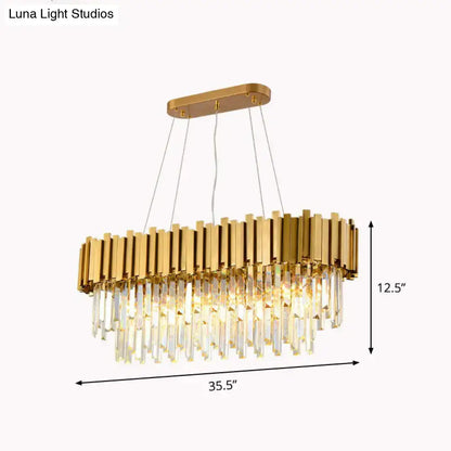 DecorBites gold postmodern oval hanging light with vertical metallic bars and cascading crystal prisms for dining room island