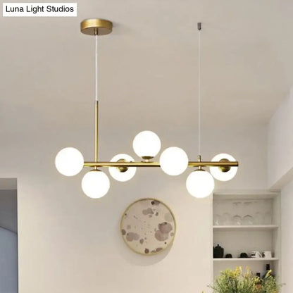Decorbites™ led island pendant light with modern brass frame and six frosted smoke grey cognac glass globe bulbs