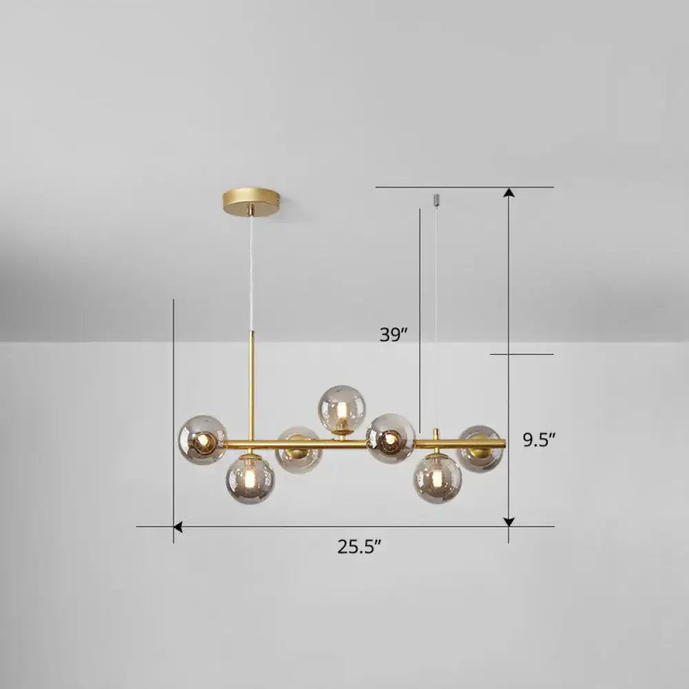 Modern brass-finished decorbites™ led island pendant light with six smoke grey cognac glass globe bulbs for dining room