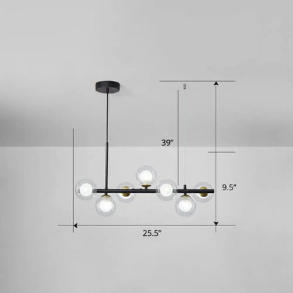 Modern black metal chandelier with six clear glass globe bulbs and brass accents for dining room lighting with smoke grey cognac details