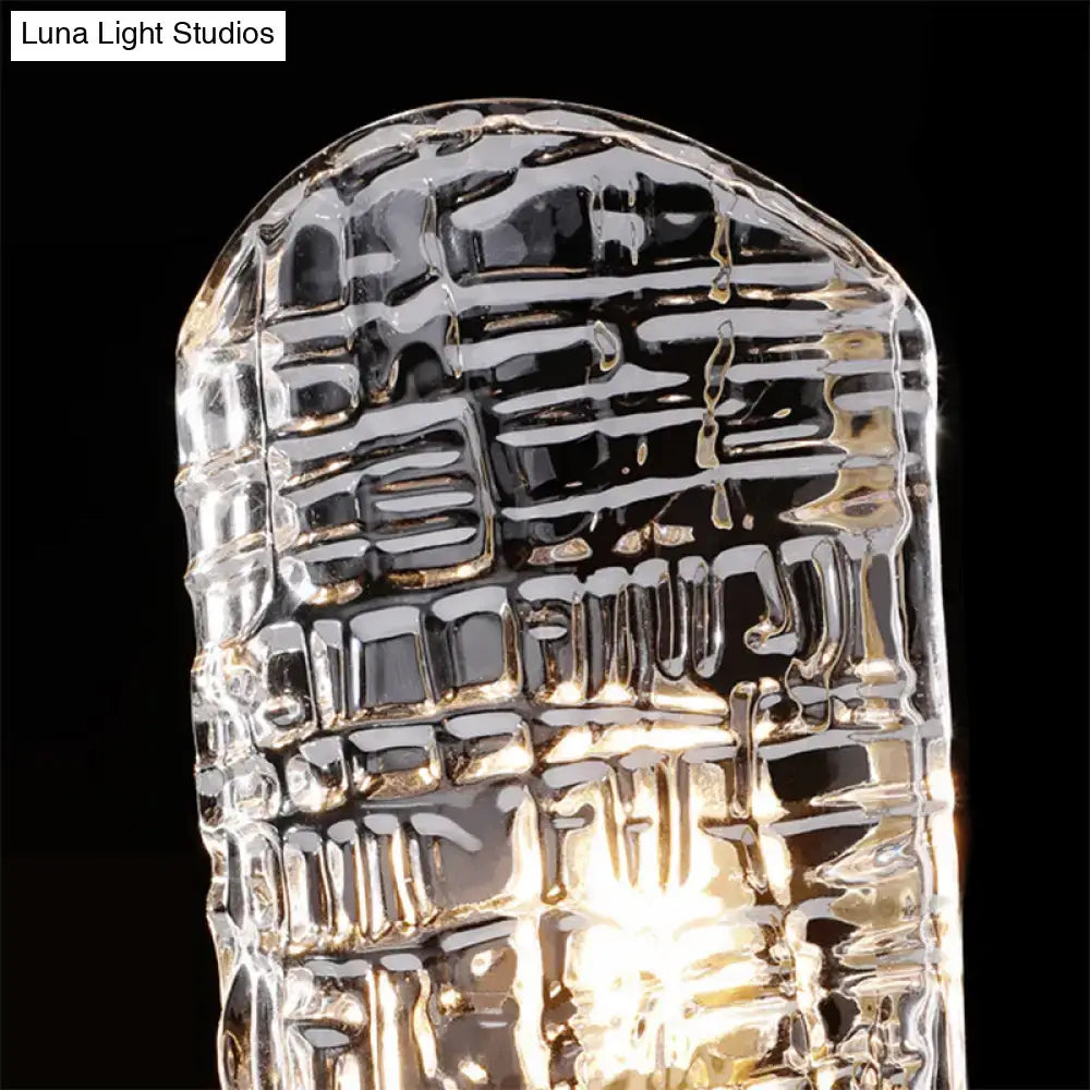 Clear glass prism textured glass gold wall light with intricate surface and arched top for corridor use