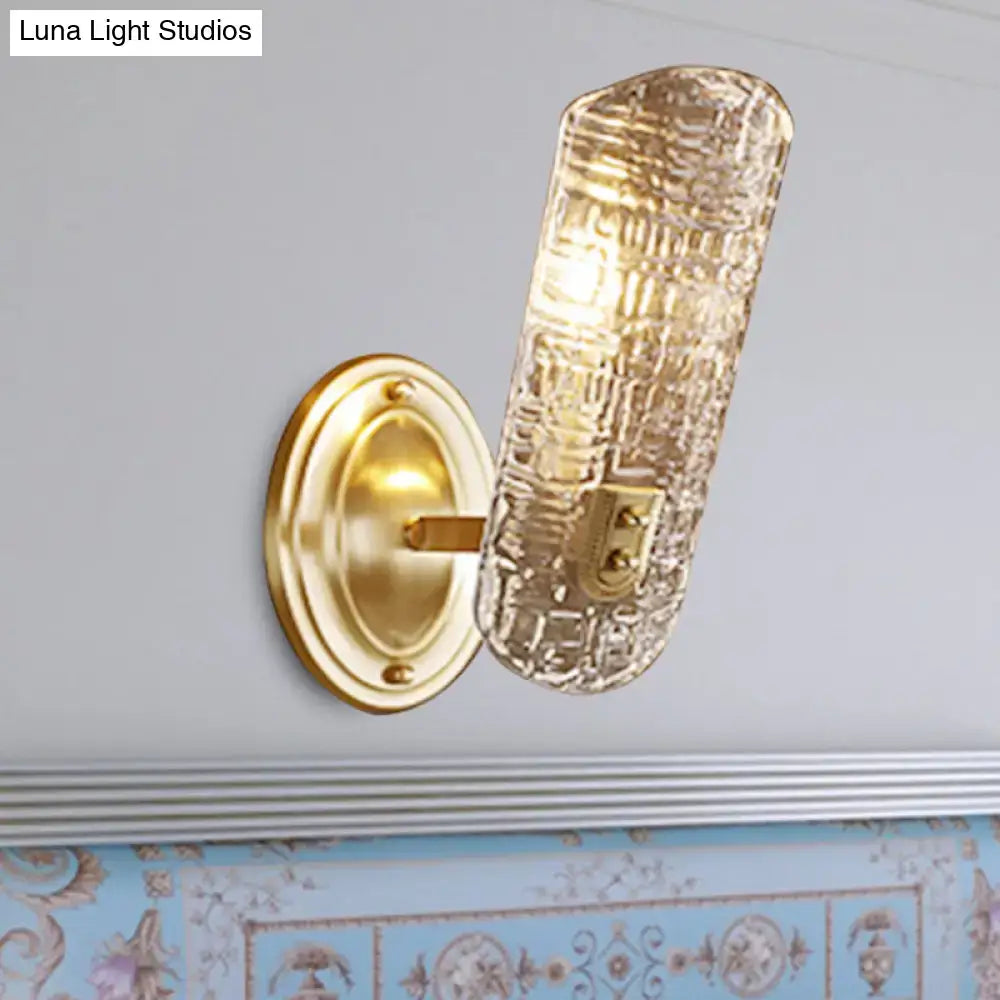 Gold-toned wall light with textured translucent glass shade designed for corridor lighting