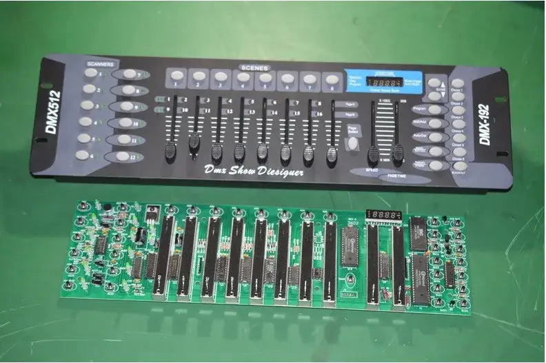 Professional black dmx controller stage with silver knobs and blue display above green circuit board for stage lights console
