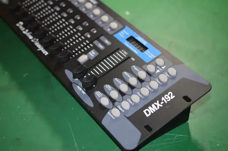 Professional black dmx controller stage with blue digital display and multiple white knobs for event room lighting