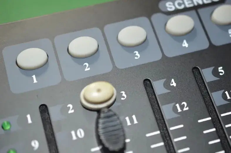 Professional black dmx controller stage lights console with white numbered knobs and central rotary encoder for events
