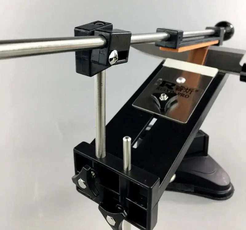 Professional black and silver decorbites knife sharpener with stone bars grinders, adjustable clamps, and orange abrasive strip