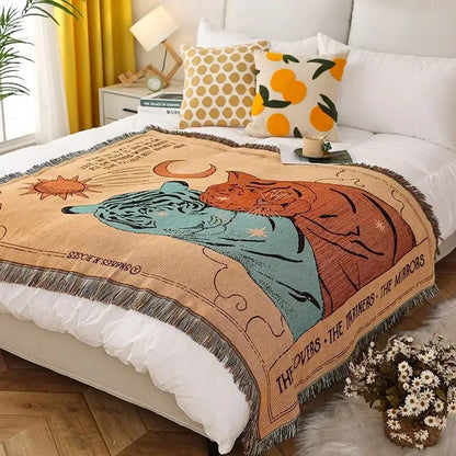 Beige woven ethnic tapestry sofa blanket with fringe edges featuring blue and orange tigers and celestial motifs