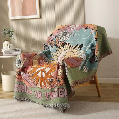 Cozy woven ethnic tapestry sofa blanket with psychedelic floral design and trust in yourself text on olive green border