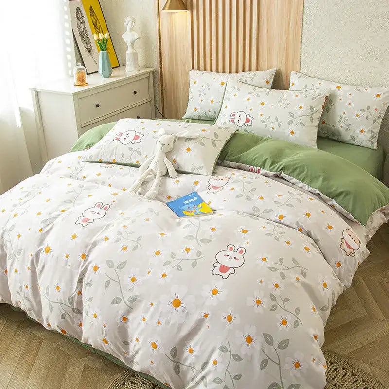 White duvet cover with playful bunny pattern and green vines in purple and blue floral leaf print bedding set