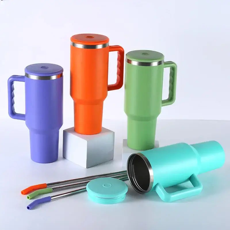 Set of colorful insulated stainless steel sippy cups in purple, teal, orange, and green with matching lids