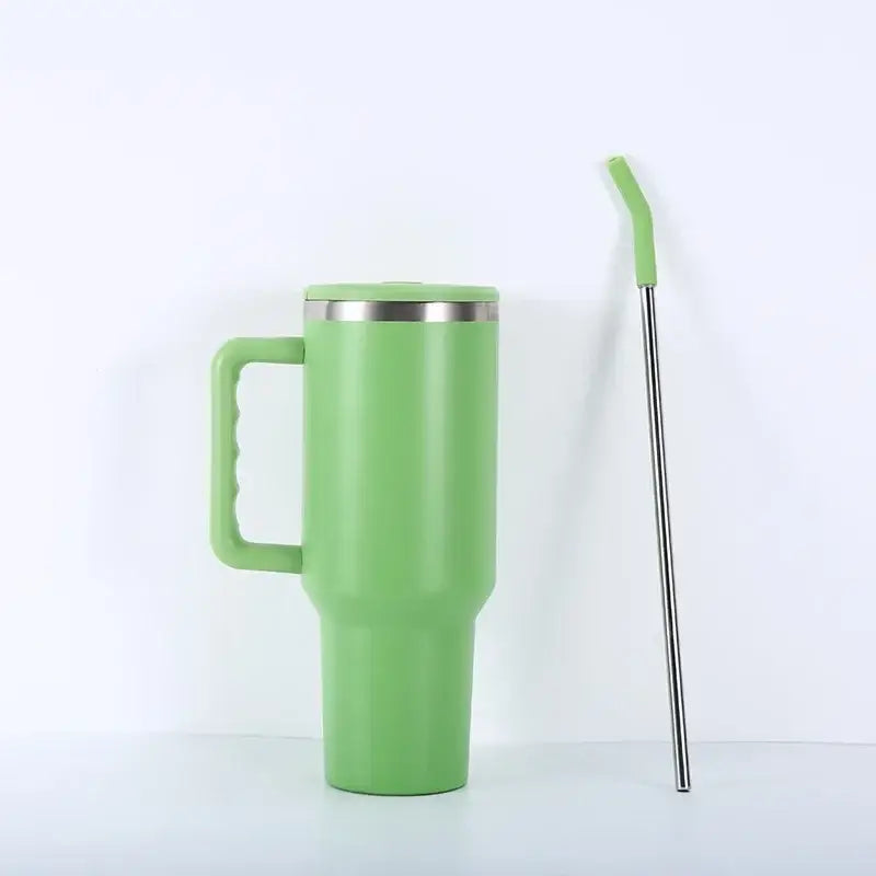 A sleek light green stainless steel travel mug with matching handle and silver rim for kitchen and travel use
