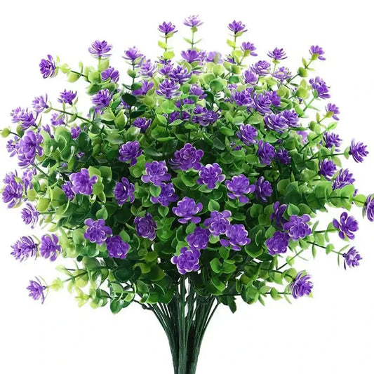 A decorbites artificial eucalyptus plant with vibrant purple blossoms and glossy green leaves for wedding decor