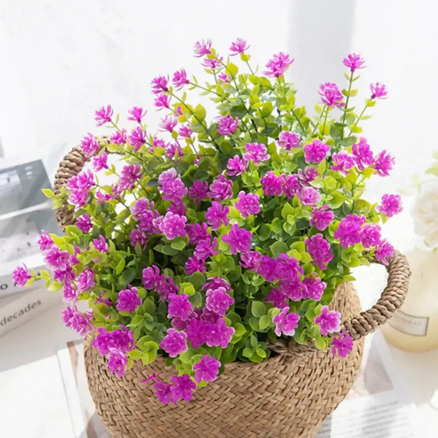 A vibrant purple decorbites artificial eucalyptus plant arranged in a woven wicker basket for wedding and living room decor
