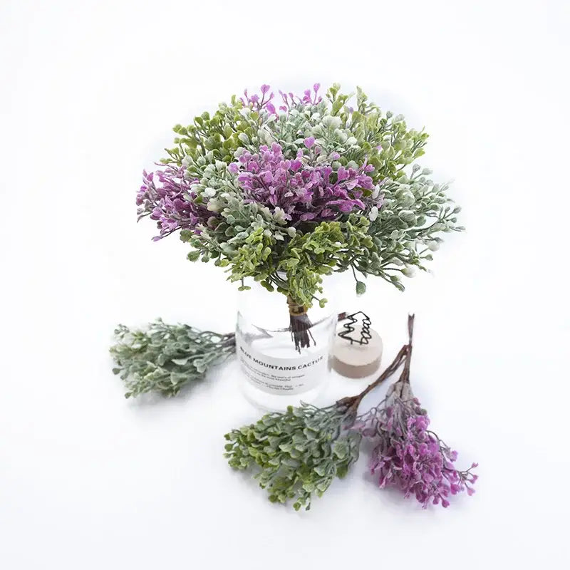A decorbites artificial flower vase featuring a delicate purple and green foliage bouquet in clear glass with mountains cactus print