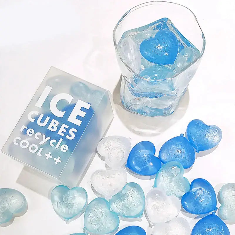 Blue and clear heart-shaped ice cubes made with a purple heart ice cube mold kitchen reusable tray