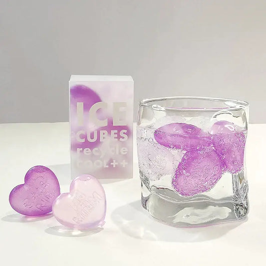Purple heart ice cubes from a reusable translucent glossy ice cube mold with a subtle gradient finish