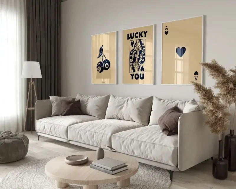 Beige modern sectional sofa with plush cushions and dark brown pillows below DecorBites Lucky Queen of Hearts trendy retro wall art