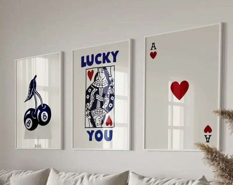 Set of three framed wall art prints with navy blue, red, and white hearts canvas featuring playing card and cherry motifs