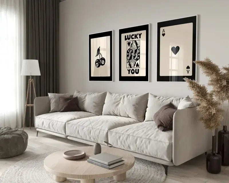 Beige upholstered sectional sofa with dark brown pillows displayed beside DecorBites™ 3-piece retro queen of hearts wall art set