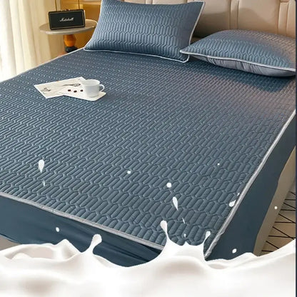 Blue quilted latex fitted sheet set with subtle geometric pattern and stitched edges for cooling mattress protection