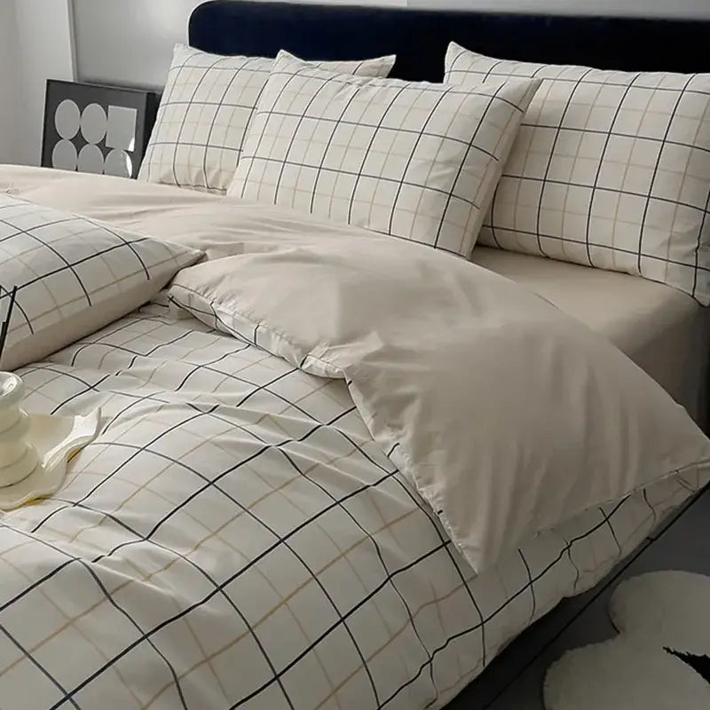 Quilted cream and black geometric printed bed set with matching pillowcases and soft grid pattern texture