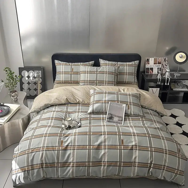 Quilted cream and black geometric printed bed set with plaid-patterned bedding in soft gray beige and brown tones