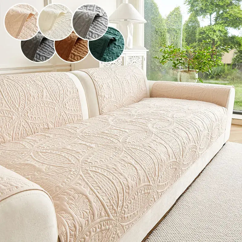 Beige quilted sofa cover with intricate leaf-patterned floral embroidery for living room cushions