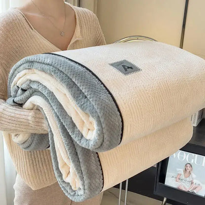 Beige and gray plush blanket with a soft textured surface and black trim from decorbites cozy cotton velvet collection