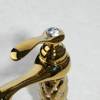 Quilted diamond decorbites golden plated bathroom basin faucet with a polished gold-finished spout and crystal handle