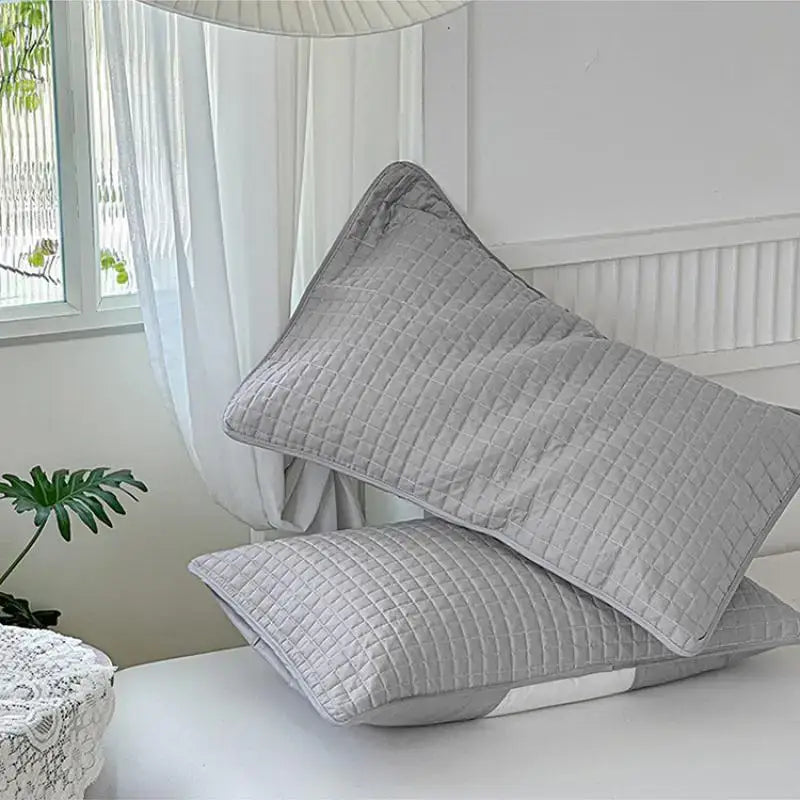 Quilted gray decorbites cotton pillowcase with subtle grid pattern made of soft fabric for bedroom use