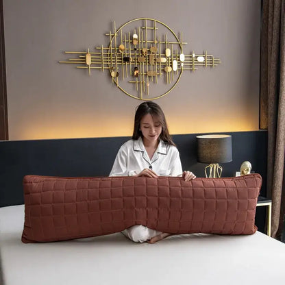 A rust-colored plush quilted body pillow with diamond stitching featuring a decorbites colorful decorative pillowcase cover