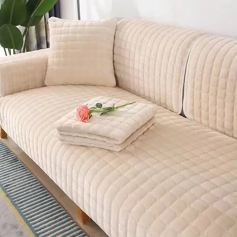 Cream-colored quilted sofa cover with plush texture and diamond-stitched pattern in gray and tan faux fur living room set
