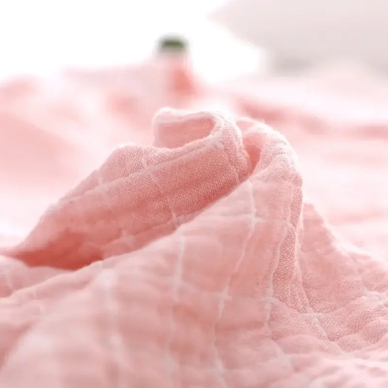 Soft pink quilted grid cotton gauze sofa cover by decorbites perfect as a living room throw blanket