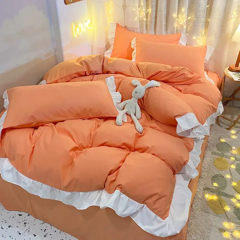 Orangish-pink ruffled duvet cover set with white lace trim complementing a quilted light blue and white bedroom bedding cover set