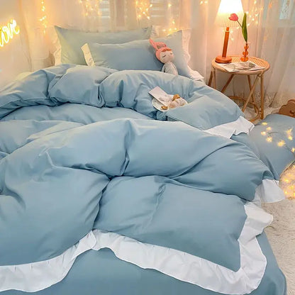 Light blue quilted duvet cover set with white ruffled trim for elegant bedroom bedding cover set